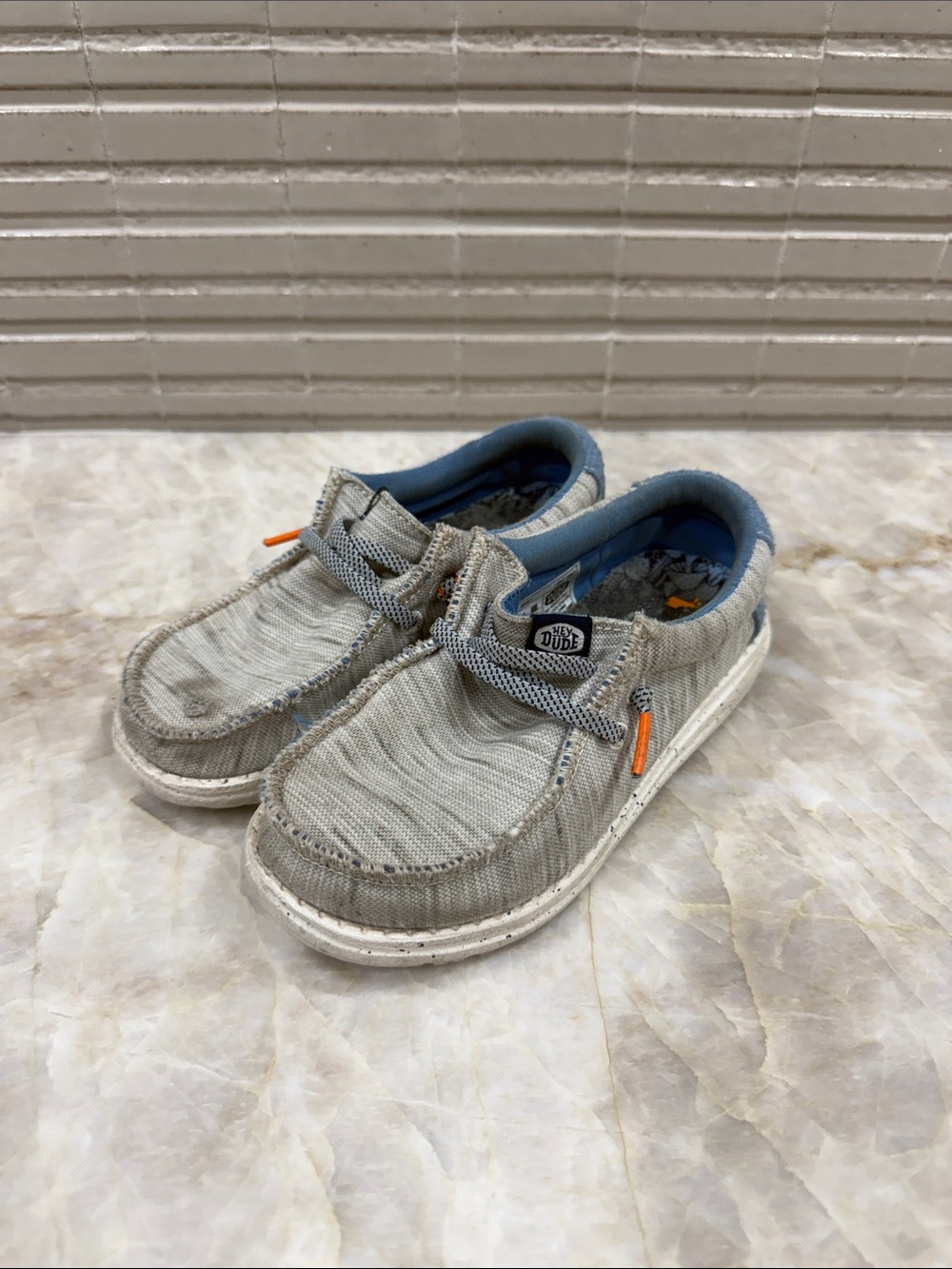 Hey Dude Kids Slip-On Sneakers in Light Gray with Blue and Orange Accents